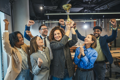 Quadro em tela Diverse business team celebrating success winning golden trophy award