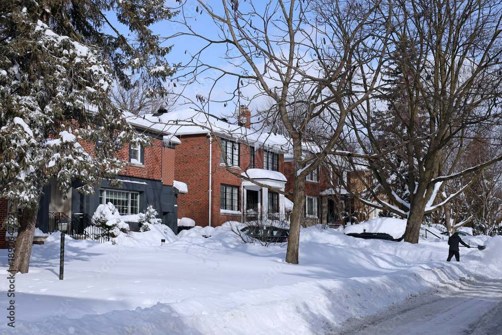 Fototapeta premium Residential street in winter after a heavy snowfall