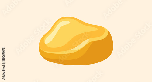 Vibrant golden nugget with shiny surface on cream background