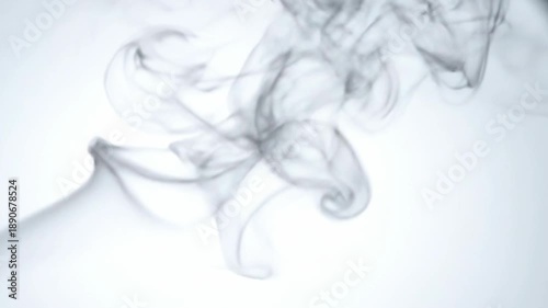 A gray smoke emanates from a cylindrical object, swirling into various shapes against a white background