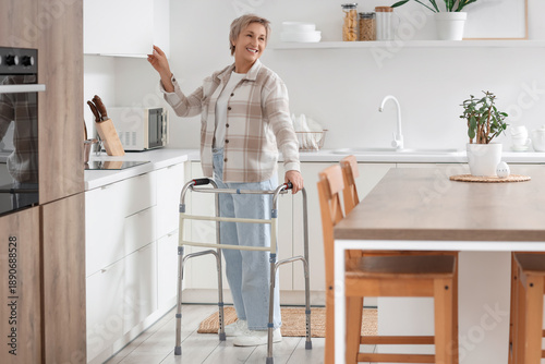 Mature woman with walker op...