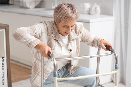 Mature woman with walker tr...