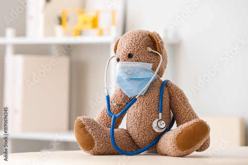 Toy bear with medical mask ...