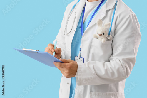 Male pediatrician with toy ...