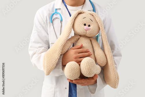 Male pediatrician with toy ...