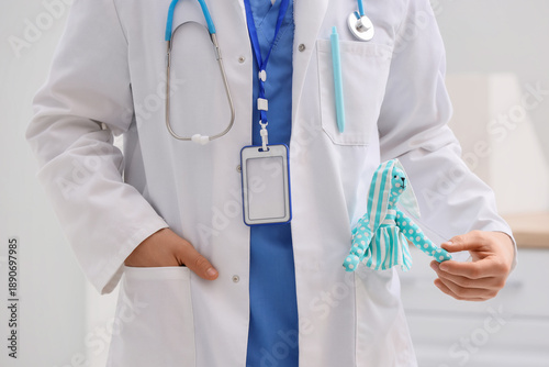 Male pediatrician with toy ...