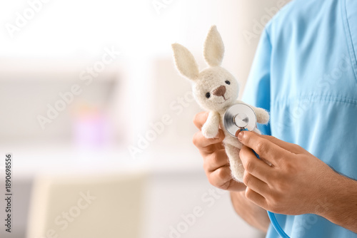 Male pediatrician with stet...
