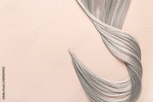 Grey hair strand on brown b...