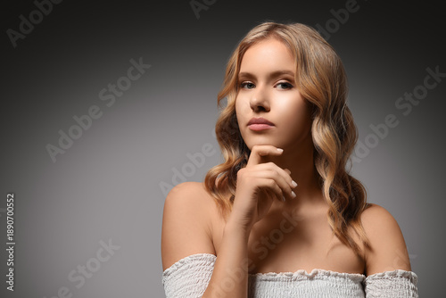 Blonde young woman with cur...