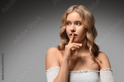 Blonde young woman with cur...