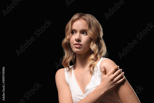 Blonde young woman with cur...