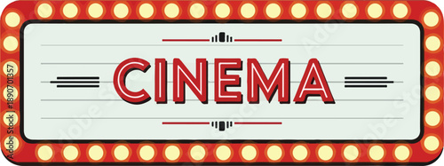 Vintage Cinema Sign Illuminated with Bright Lights and Decorative Border at Night