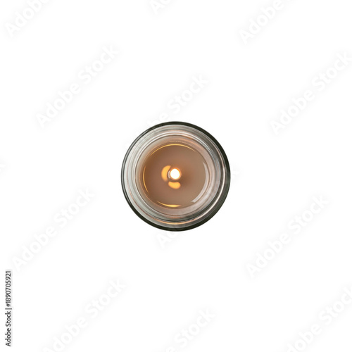 Top view of a lit candle in a glass jar