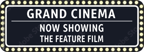 A cinema marquee sign displaying the announcement of a feature film in a grand cinema venue
