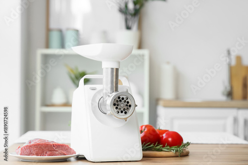 Modern meat grinder with be...