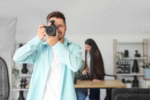 Male photographer with came...