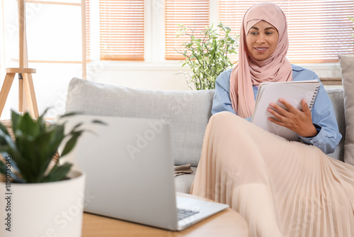 Young Muslim woman learning...