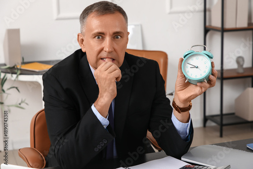 Worried mature businessman ...