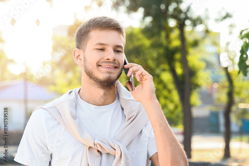 Handsome young happy man ta...