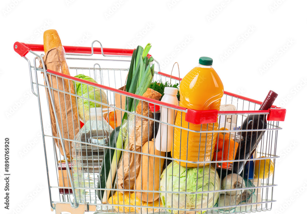 Naklejka premium Shopping cart with different fresh products on white background