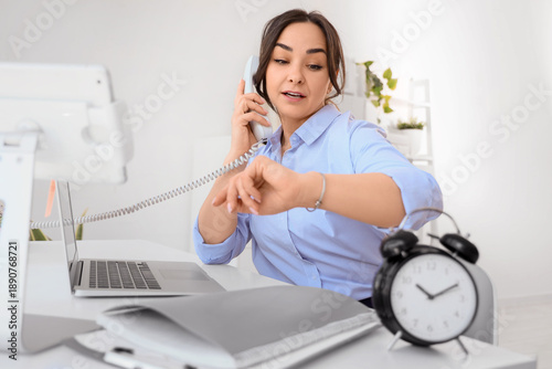 Businesswoman talking by ph...