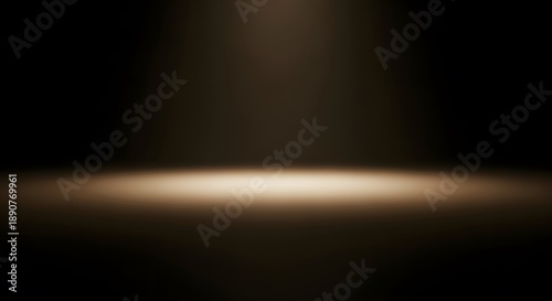 Dramatic warm spotlight beam on a dark brown background for product presentation and showcase
