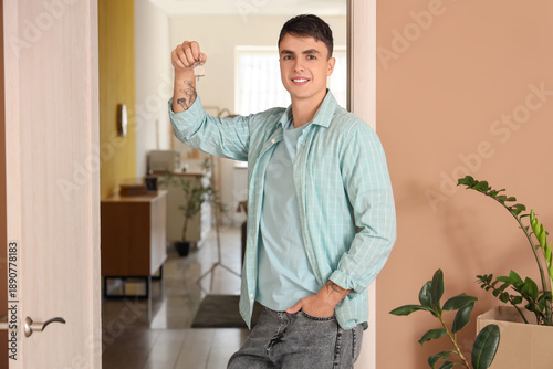 Young man with key from his...