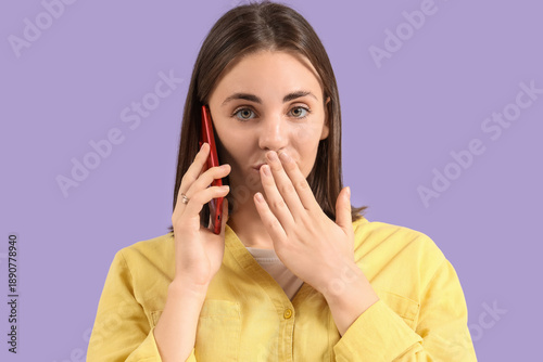 Shocked young woman talking...