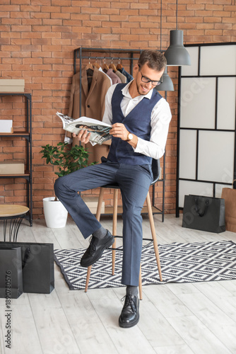 Young businessman reading m...