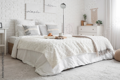 Interior of light bedroom w...