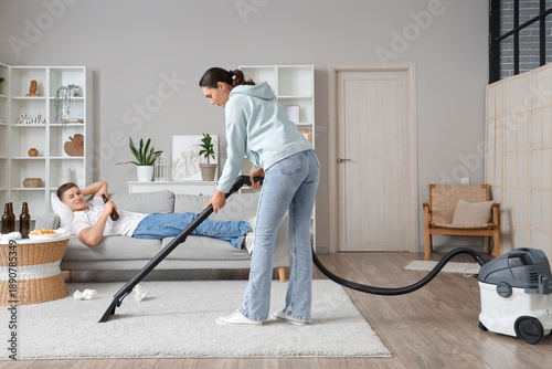 Wife vacuum cleaning carpet...