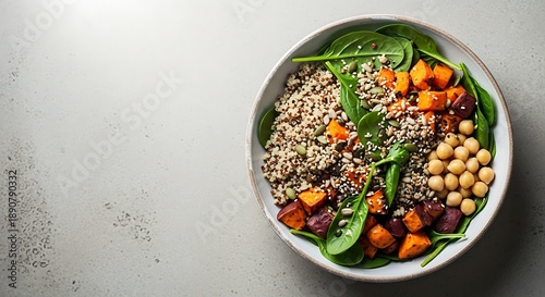 Healthy bowl with quinoa chickpeas sweet potatoes and spinach