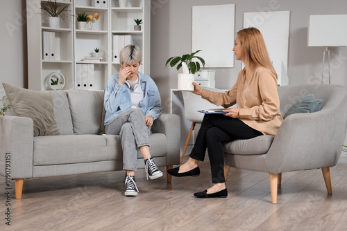 Female psychologist giving ...