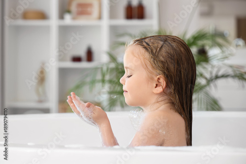 Cute little girl with soap ...