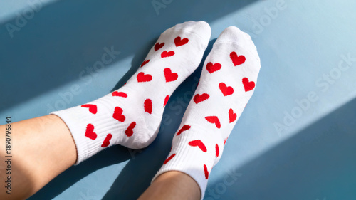 Wallpaper Mural Person wearing white socks with red hearts pattern on blue background Torontodigital.ca
