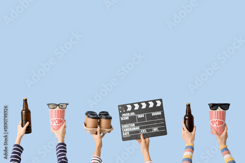 Many hands with movie clapp...
