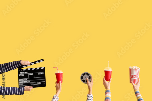 Many hands with movie clapp...
