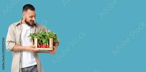 Young man holding box of ri...