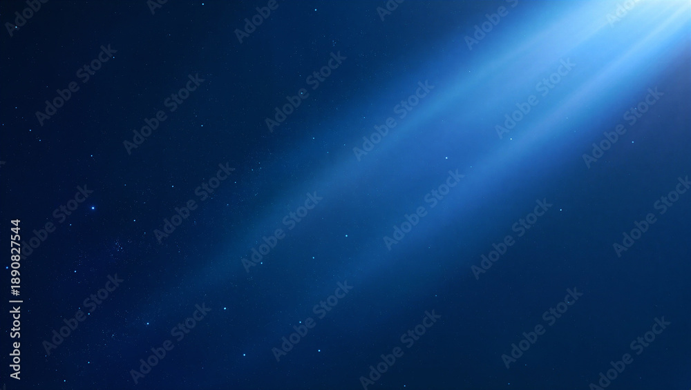 Fototapeta premium Deep blue space background with bright blue light rays and sparkling stars.
