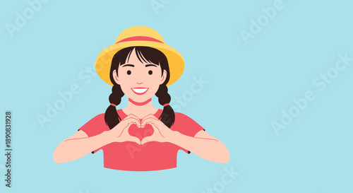 Smiling young girl with braids and a yellow hat makes a heart symbol with her hands against a light blue backdrop.