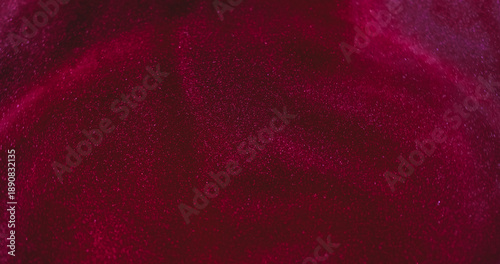 Glitter curve defocused. Shimmering mix. Bright red pink sparkling color glowing on abstract ink texture vivid particles background.