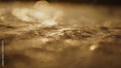 Subtle Aquatic Reflections Gentle, undulating water effects casting light onto a surface.