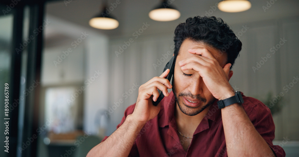 © WesJVR/peopleimages.com - Upset, man and talk in home with phone call, feedback and disappointed for financial crisis problem. Frustrated, person and conversation in house with tech, contact and stress for finance debt risk.