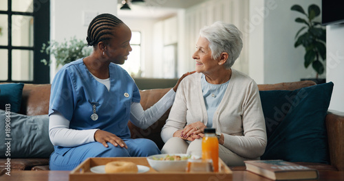 Konstfotografi Conversation, nurse and senior woman on sofa in home for healthcare consultation with diagnosis