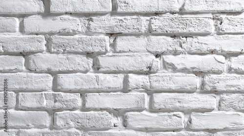 A close-up view of a textured brick wall with a rough surface