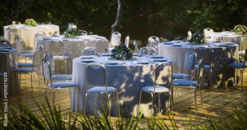 Tableau sur toile Corporate outdoor luncheon with round tables, blue linens and glassware, plated