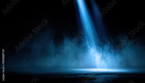 Dramatic blue spotlight pierces through smoky darkness, illuminating a wet, reflective surface