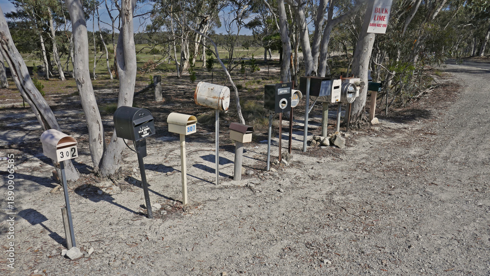 Αυτοκόλλητο Bush boxes -letterboxes line the side of a dusty backroad in country New South Wales