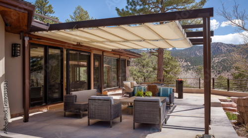 Modern patio, pergola, awning, outdoor furniture, mountain view, terrace, contemporary design with sunny forest backdrop