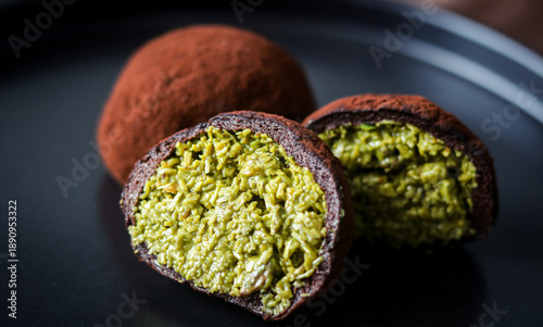 Close-up of a Dubai Chewy Cookie split open, showing a rich pistachio and kataifi filling.